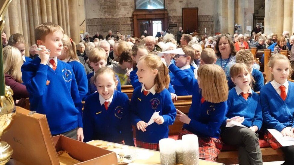Pupils and Pershore Abbey's congregation