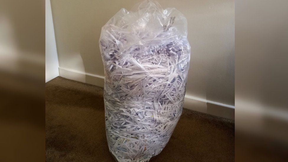 Bag full of shredded debt letters