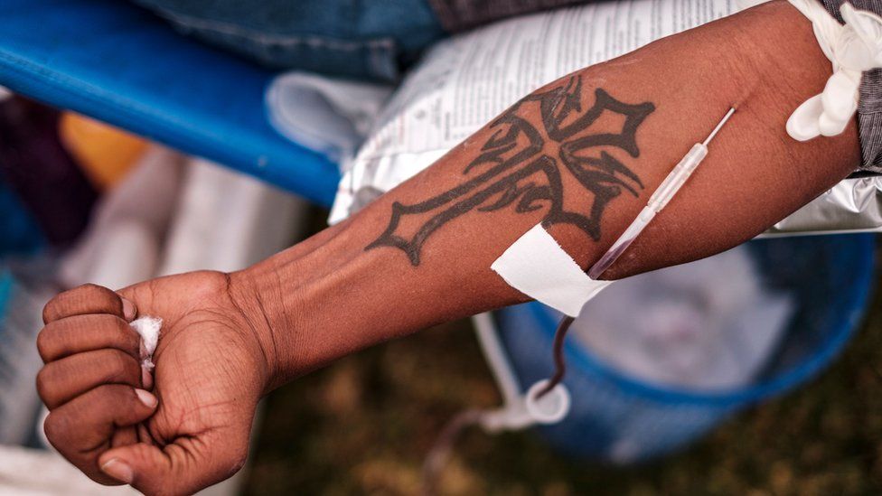 The tattooed arm of a man giving blood in Addis Ababa, Ethiopia - 12 November 2020