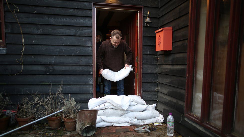 A resident prepares his house against further flooding on January 2, 2014 in Yalding