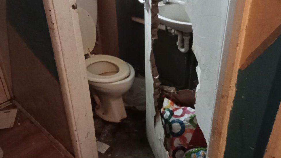 A hole in the toilet door