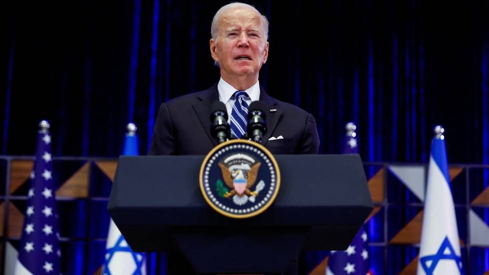 Joe Biden speaking at lectern in Israel