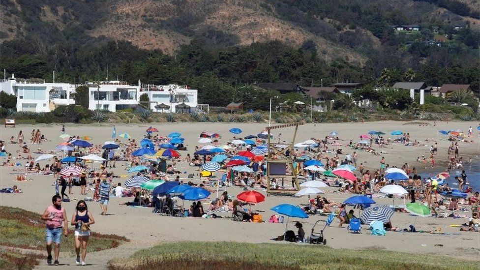 People spend the day at the Cachagua beach during the outbreak of the coronavirus disease (COVID-19) in Zapallar, Chile February 8, 2021.
