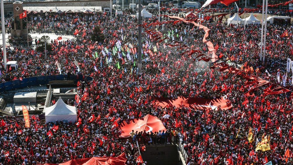 Demonstrators wave Turkish flags and picture of Ataturk, founder of modern Turkey, in Istanbul"s Taksim Square on July 24, 2016 during the first cross-party rally to condemn the coup attempt against President Recep Tayyip Erdogan.