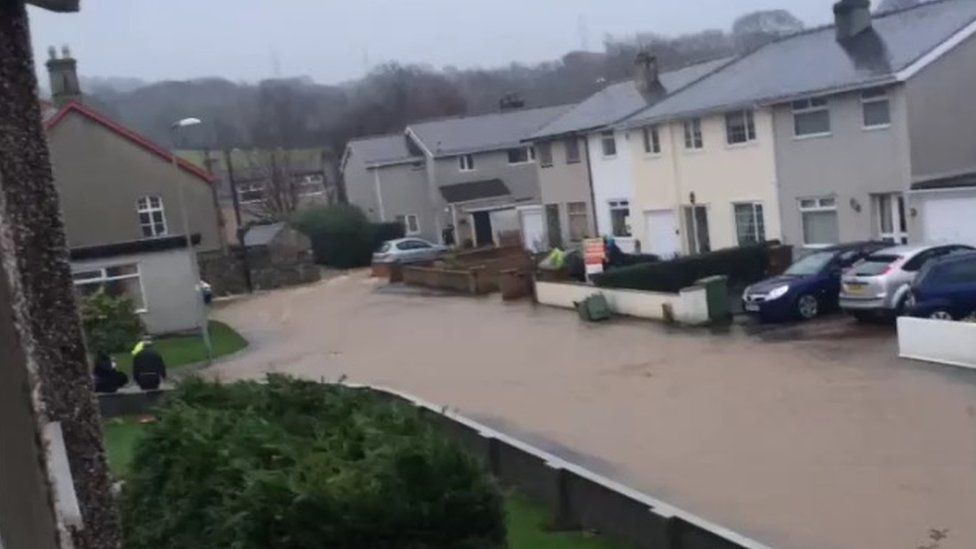Flood water surrounds homes in Tal-y-Bont near Bangor