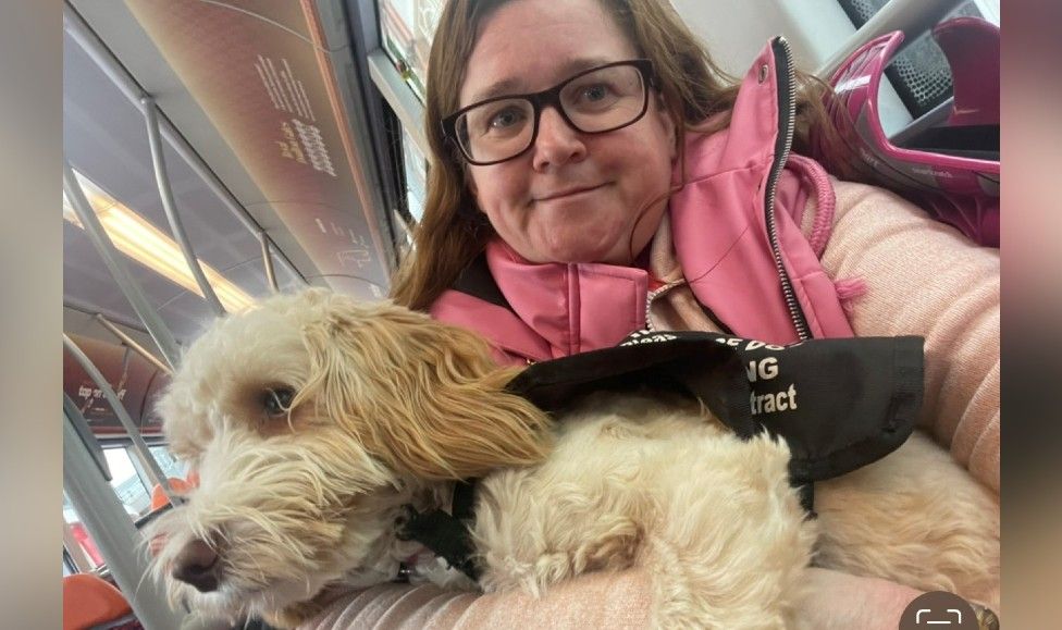 A disabled woman and her service dog