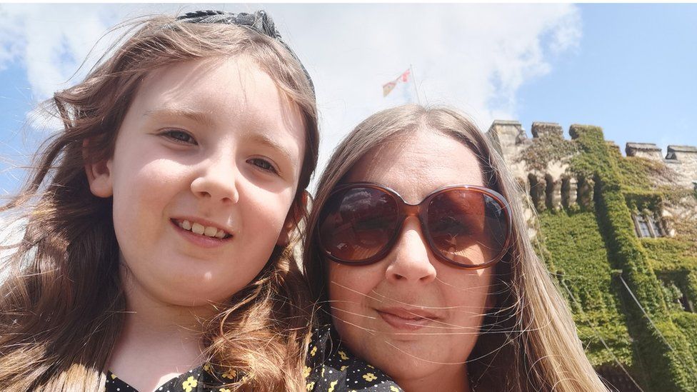 Hannah Nash and her daughter Isla outside a castle