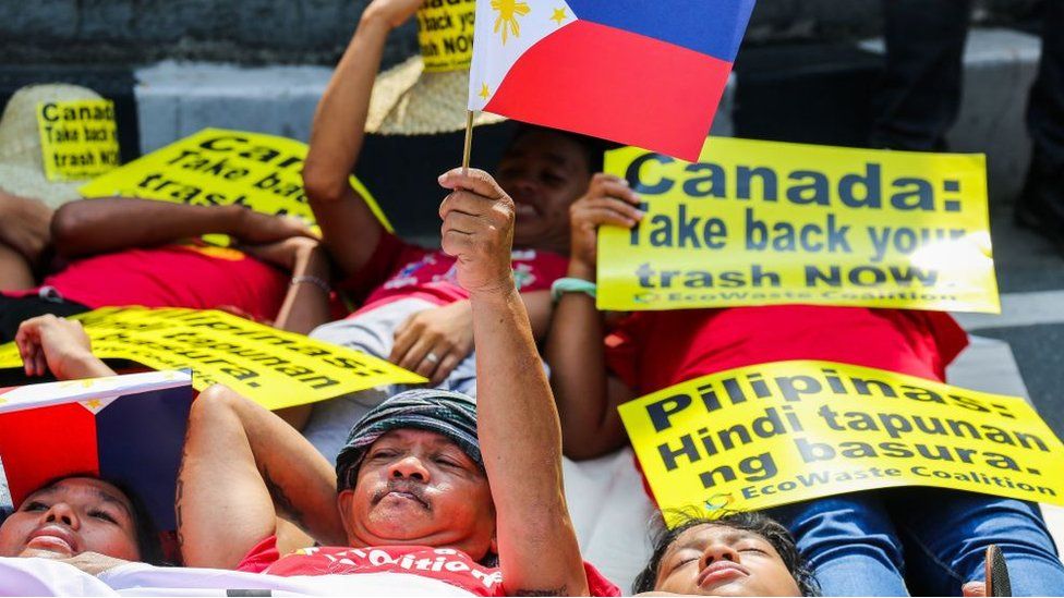 Environmental activists protest outside the Canadian embassy in Manila on May 21, 2019, to push the government of Canada to speed up removal of their garbage out of Manila and Subic Ports.