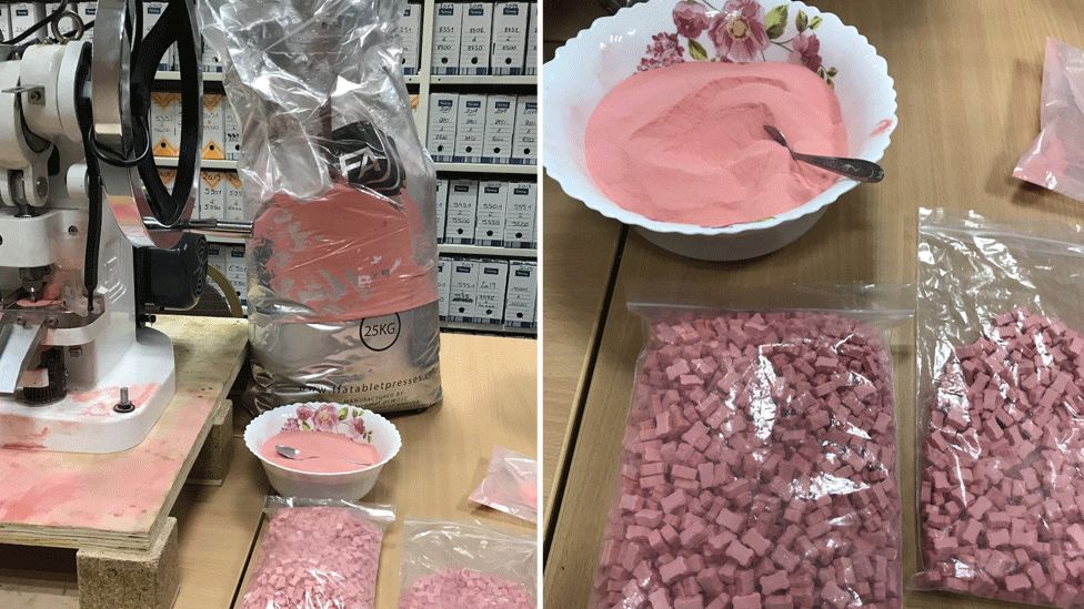 Pink powder and tablets displayed as the result of a police raid