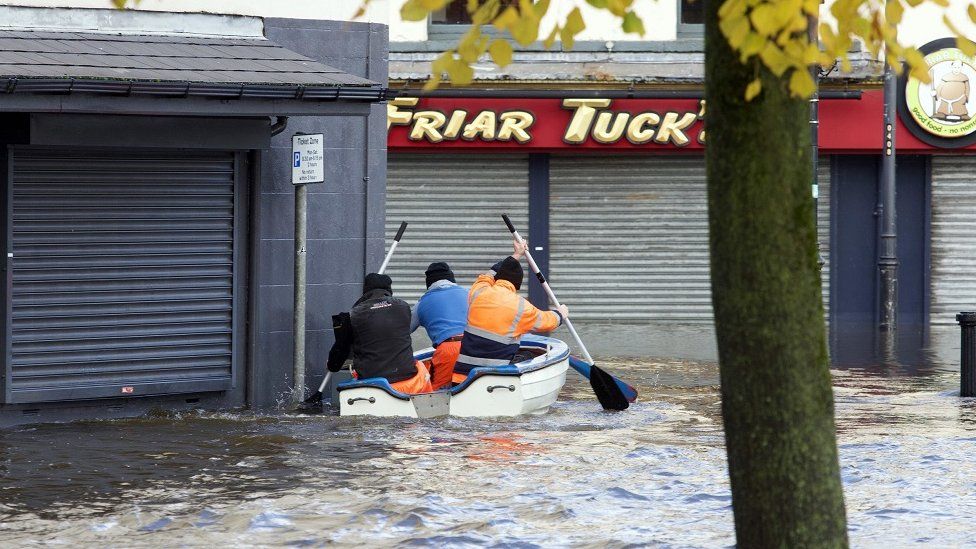 A boat was paddled up a flooded road in front of the Arts Centre in Newry on Tuesday morning
