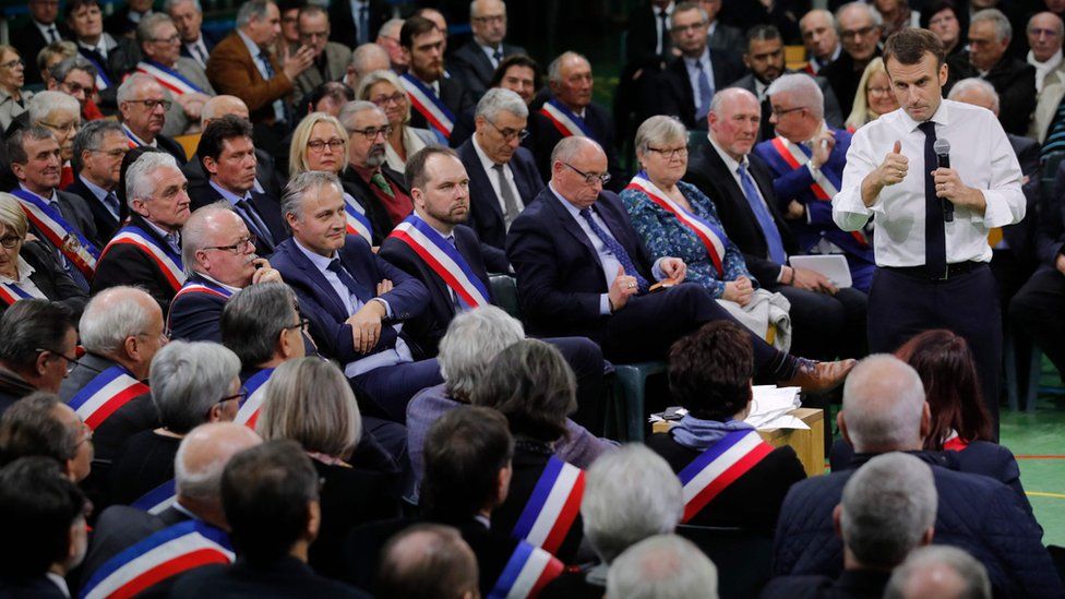 French President Emmanuel Macron speaks during a meeting gathering some 600 mayors who will relay the concerns aired by residents in their towns and villages in the Normandy city of Grand Bourgtheroulde on January 15, 2019