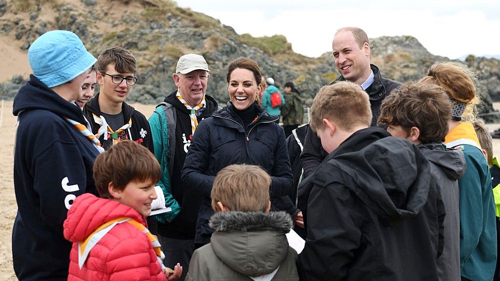 Catherine and William on the beach in Anglesey with scouts