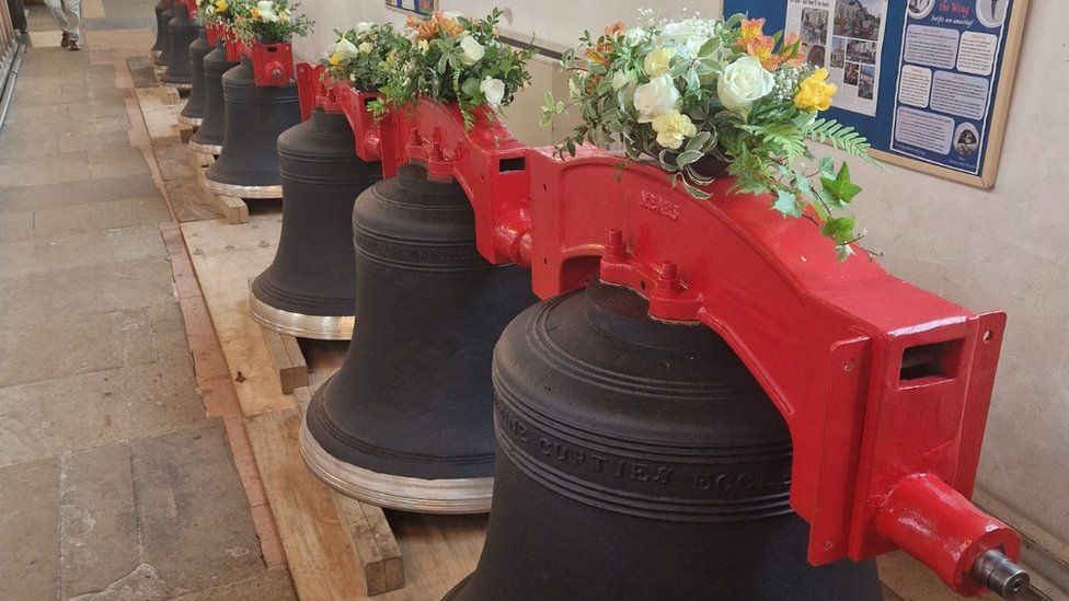 Church bells decked with flowers