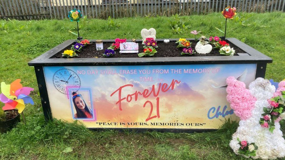 Flower planter box dedicated to Chloe Mitchell with 'Forever 21' written on it