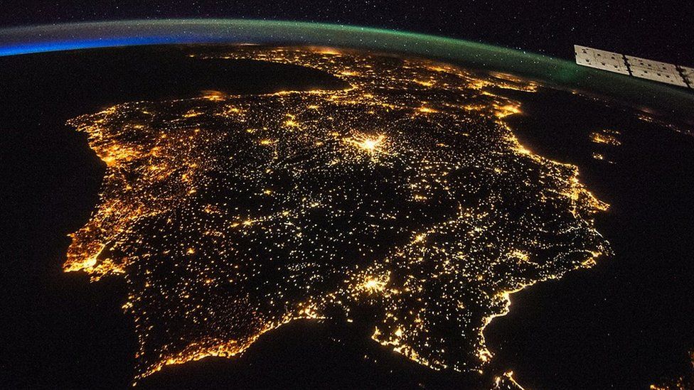 Glowing cities at night - captured from the International Space Station - look beautiful, but actually show pollution and wasted energy