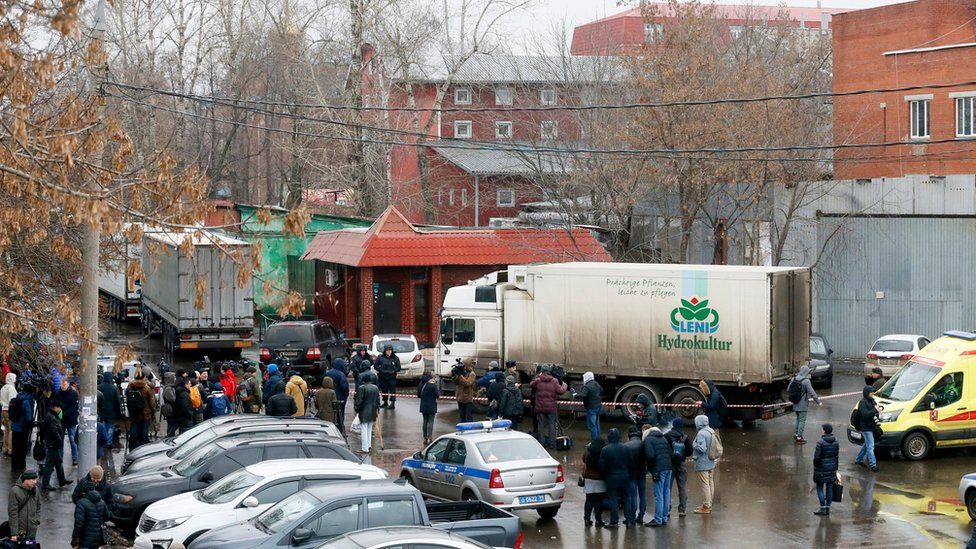 People gather near "Menshevik" confectionery plant where a gunman opened fire in Moscow