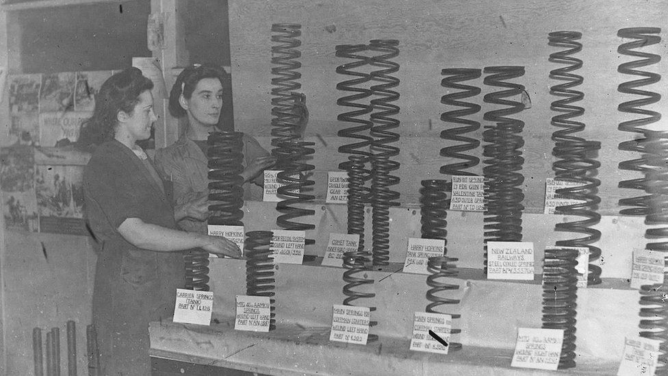 Women workers standing next to springs for artillery at Quin's bedding factory, Newcastle, January 1945
