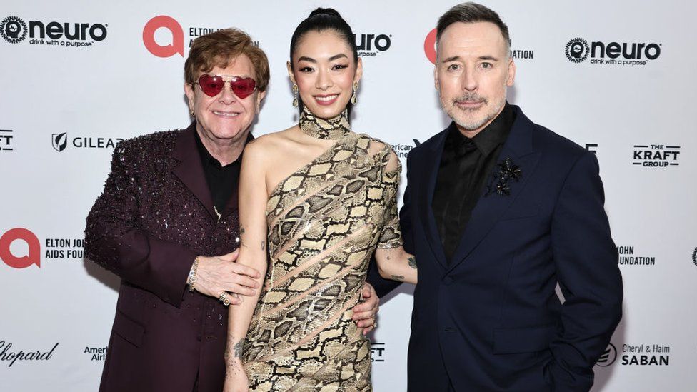 Elton John and partner David Furnish at a fundraising event for Aids Foundation with singer Rina Sawayama