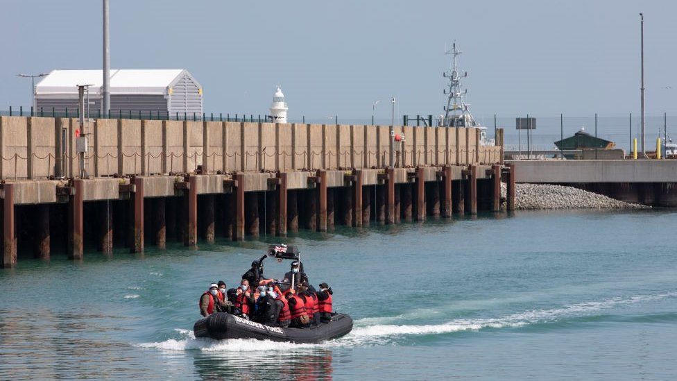 A group of people thought to be asylum seekers brought into Dover by Border Force