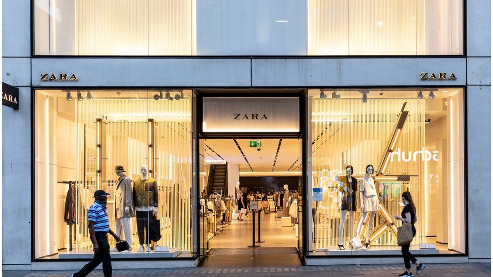 Shoppers walking past a Zara shop at London's Oxford Street