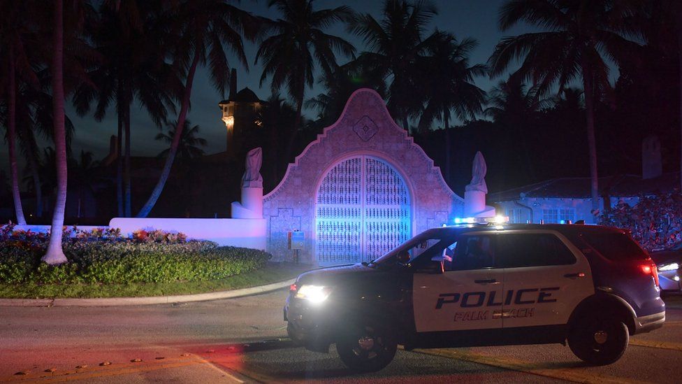 A police car stands guard outside Mar-a-Lago on 8 August