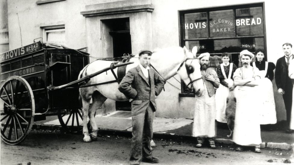 Bread cart with bakery staff