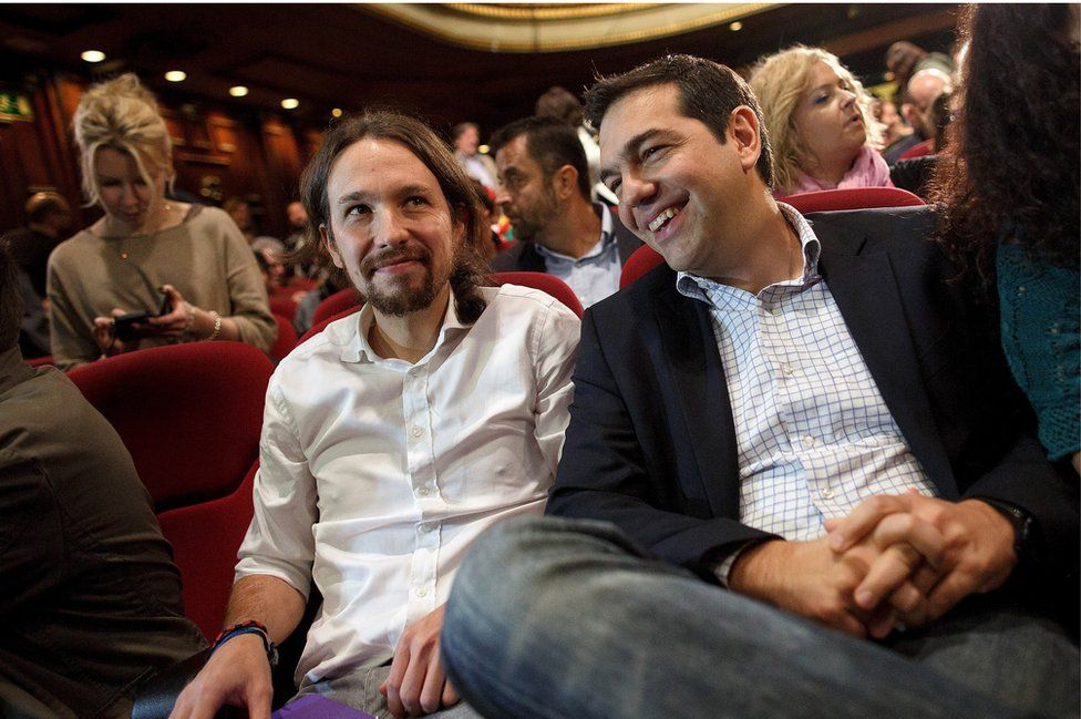 Podemos Party leader Pablo Iglesias (left) sits next to leader of Greece's left-wing political party Syriza, Alexis Tsipras