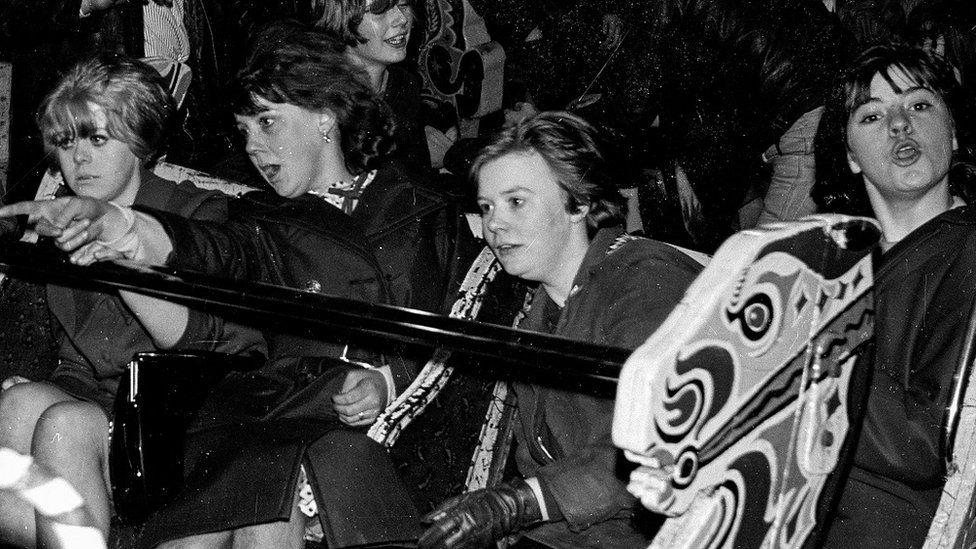 Women enjoying a fairground ride