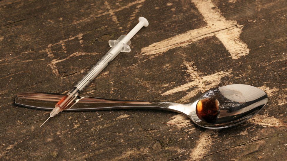 Heroin needle and spoon
