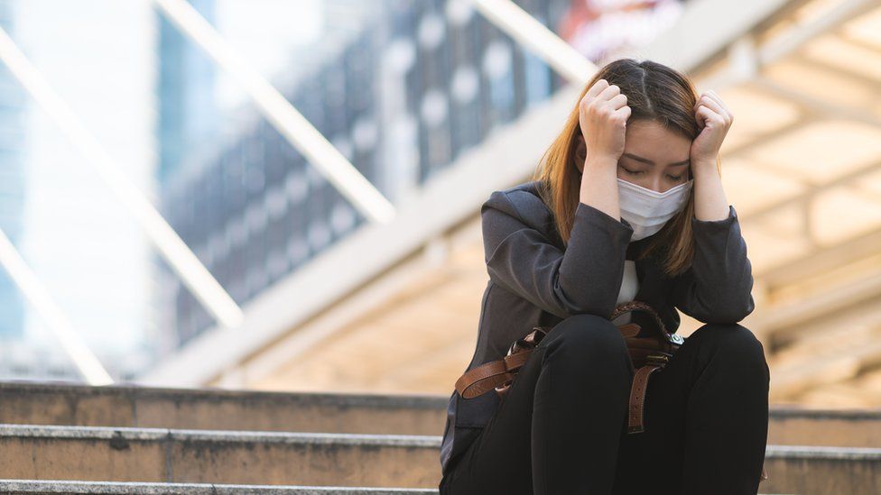 woman wearing a mask