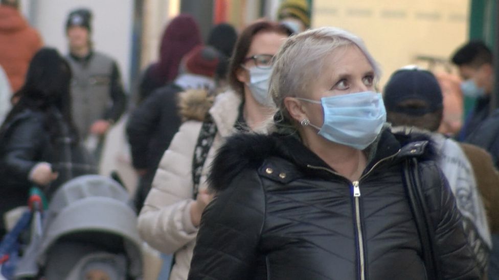 Woman wearing mask on Strand Street