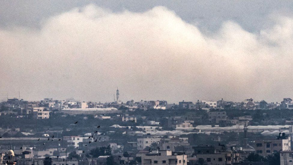 A cloud of smoke covers the skyline of Gaza
