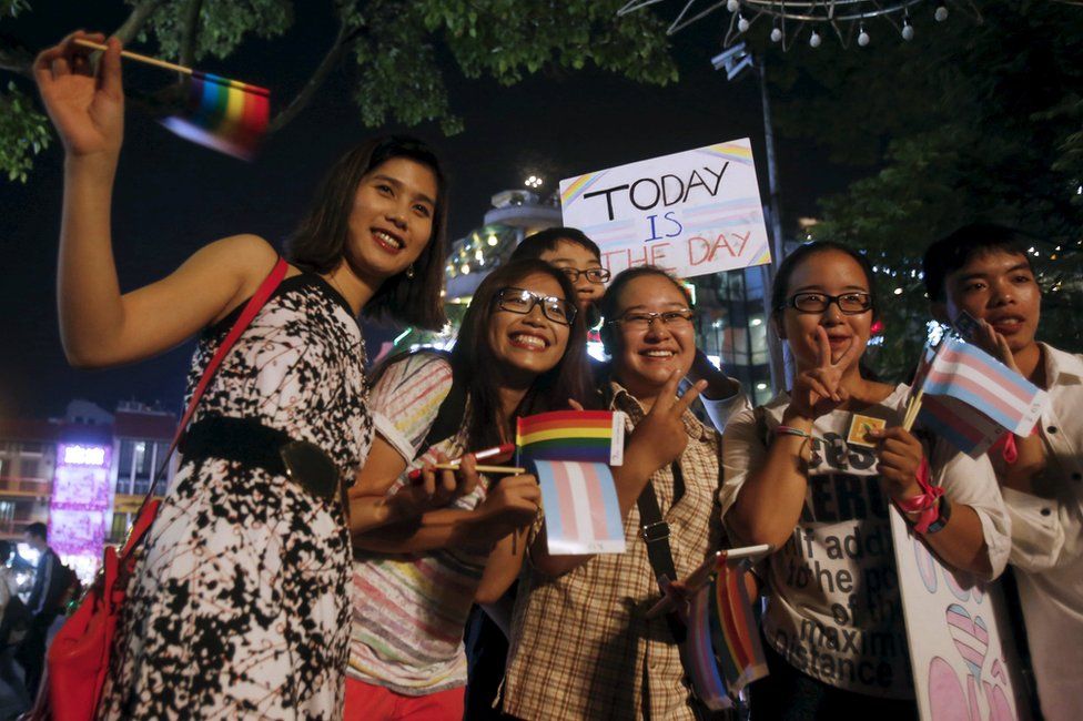 Transgender Anh Phong (L), 27, who changed her gender from a man to a woman, poses for a photo with members of LGBT (lesbian, gay, bisexual and transgender) community before a demonstration along a street in Hanoi, Vietnam 24 November 2015