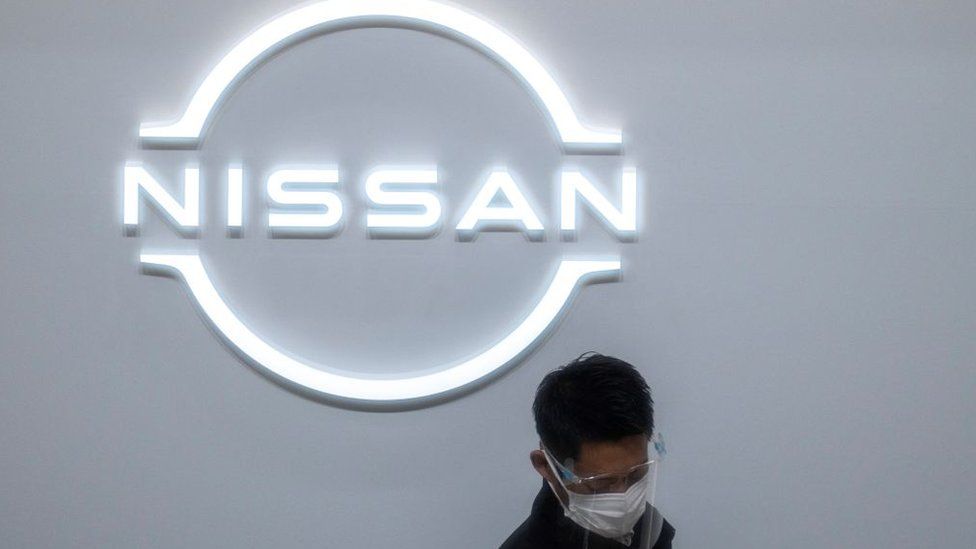 A staff member is pictured at the reception of the showroom at the Nissan Motor global headquarters in Yokohama, Kanagawa prefecture