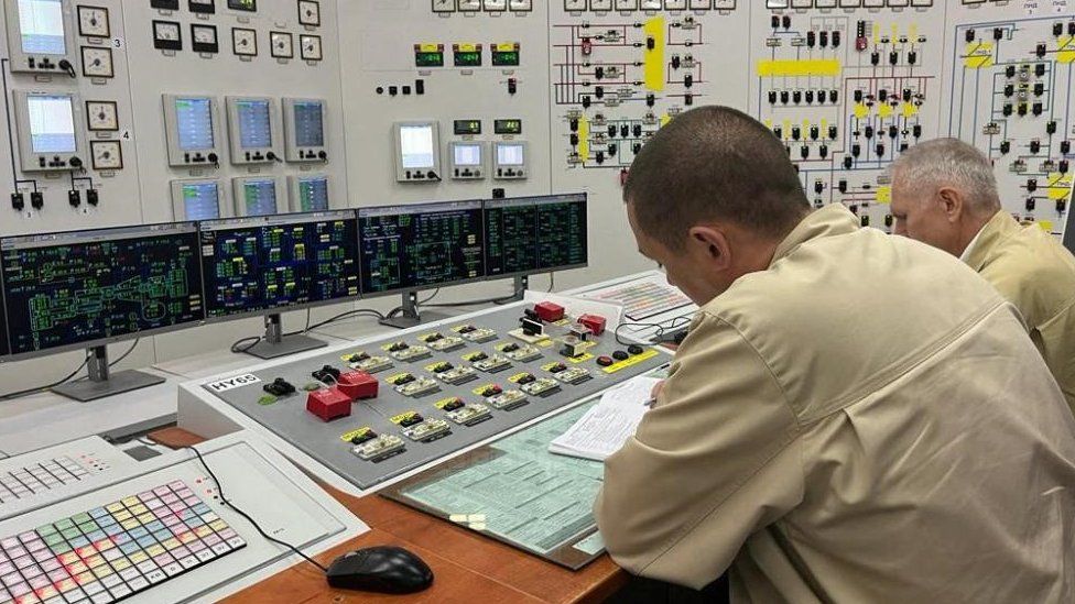 Employees work at the Russian-controlled Zaporizhzhia Nuclear Power Plant during a visit by members of the International Atomic Energy Agency (IAEA)