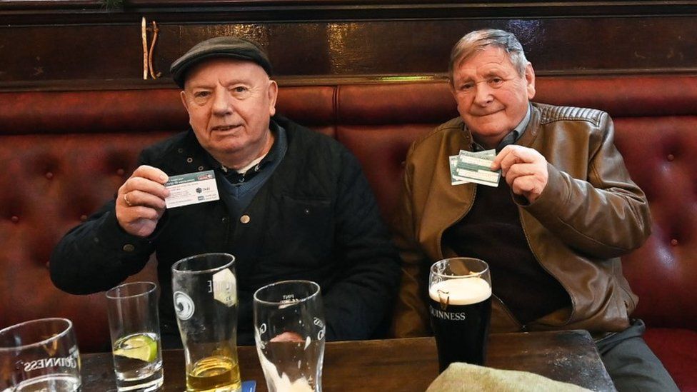 Pub goers showing proof of vaccination