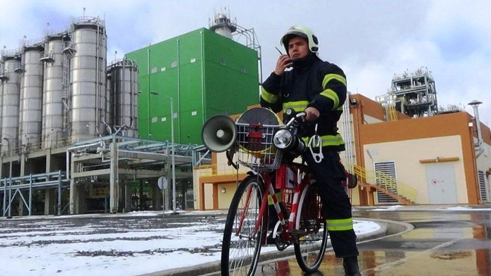 A fire-fighter demonstrates the new bike