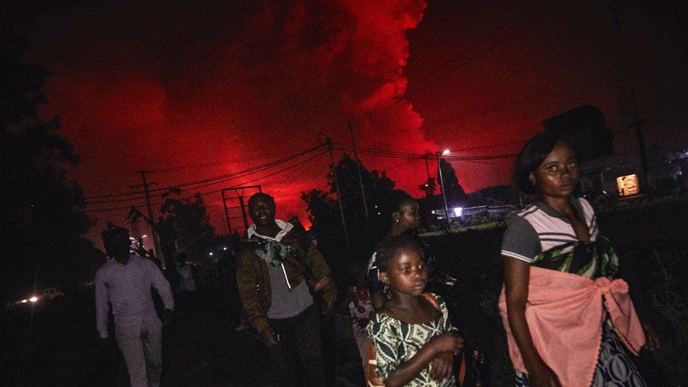 Congolese residents of Goma flee from Mount Nyiragongo volcano as it erupts over Goma