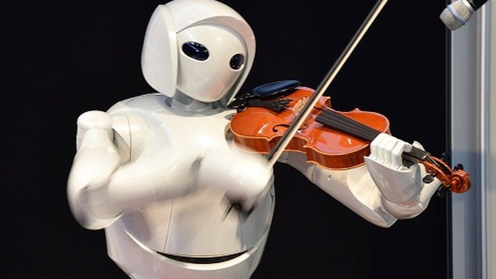 Toyota's violin-playing robot plays at Universal Design Showcase on December 6,2007 in Tokyo, Japan. The robot, which has 17 joints in both arms, uses precise control to play the violin. Toyota aims to develop robot technology to assist nursing and medical care by the year 2010