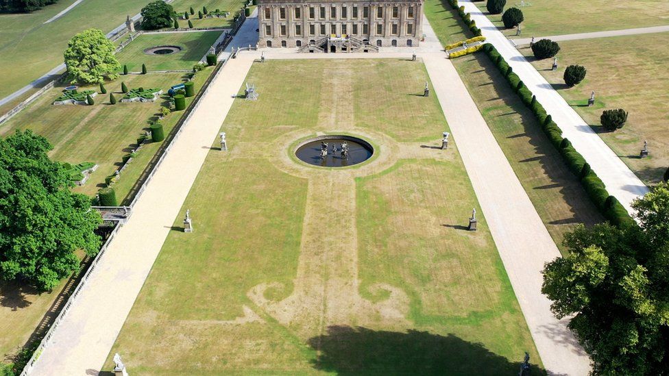 An aerial view of the lawn at Chatsworth House in Derbyshire shows the pattern of a 17th-century garden revealed after the grass dried out in the heat