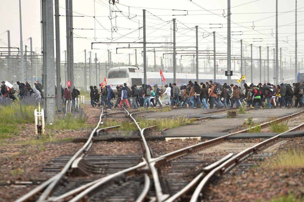 Protesters cross railway tracks at Rennes, 26 May