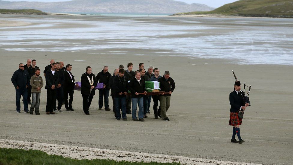 Eilidh MacLeod's coffinbeing brought along beach in Barra
