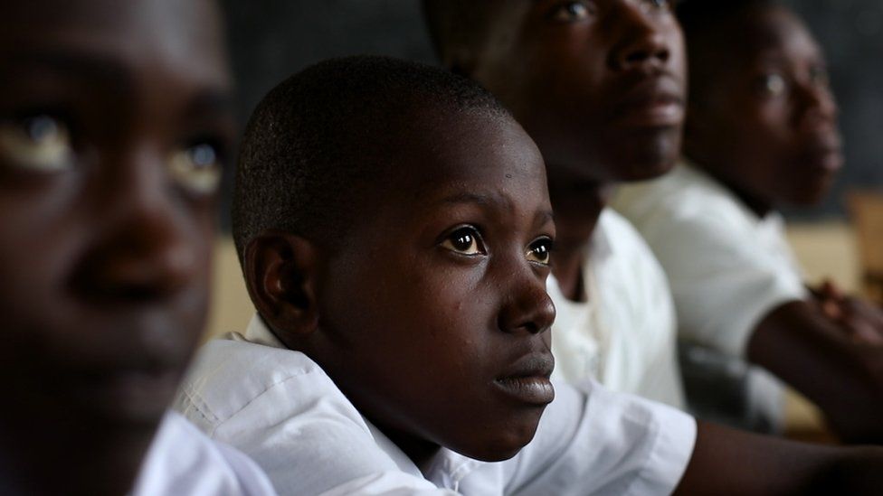 Boys participate in roundtable discussions to talk about ending gender-based violence in Rwanda.