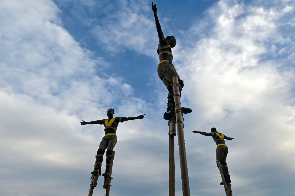 Men on stilts from Togo from a troupe called Afuma performing in KrakÃ³w, Poland - Saturday 9 July 2022