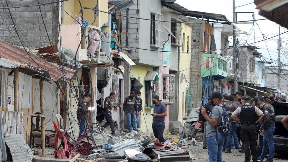 Police officers collect evidence to clarify the cause of the explosion recorded on Tenth Street, between H and I, Cristo del Consuelo neighbourhood on August 14, 2022 in Guayaquil, Ecuador.