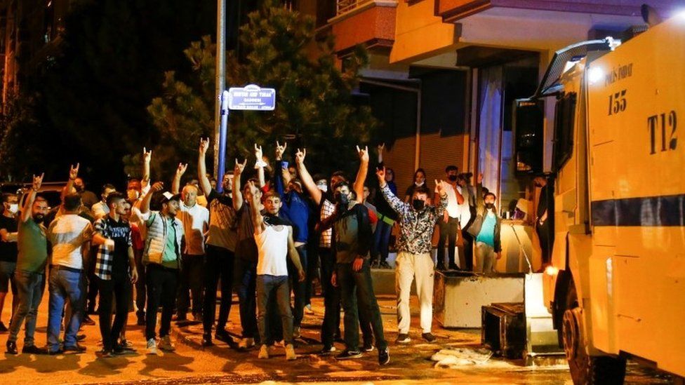 Demonstrators gesture during riots against refugees in Ankara, Turkey