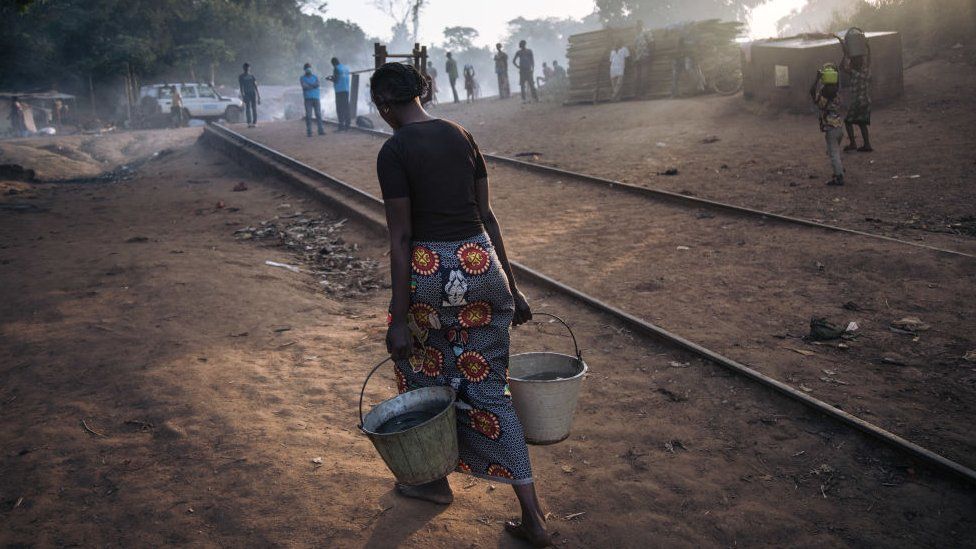 Central African refugee woman carried water to the refugee site at Ndu, Bas-Uele, DRC on 21 January 2021