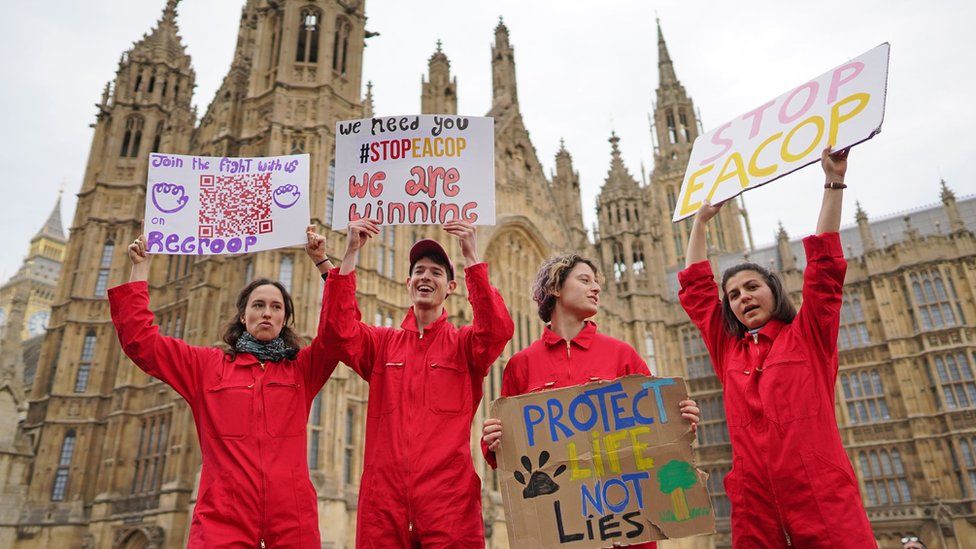 Extinction Rebellion demonstrators take part in a rally outside Parliament