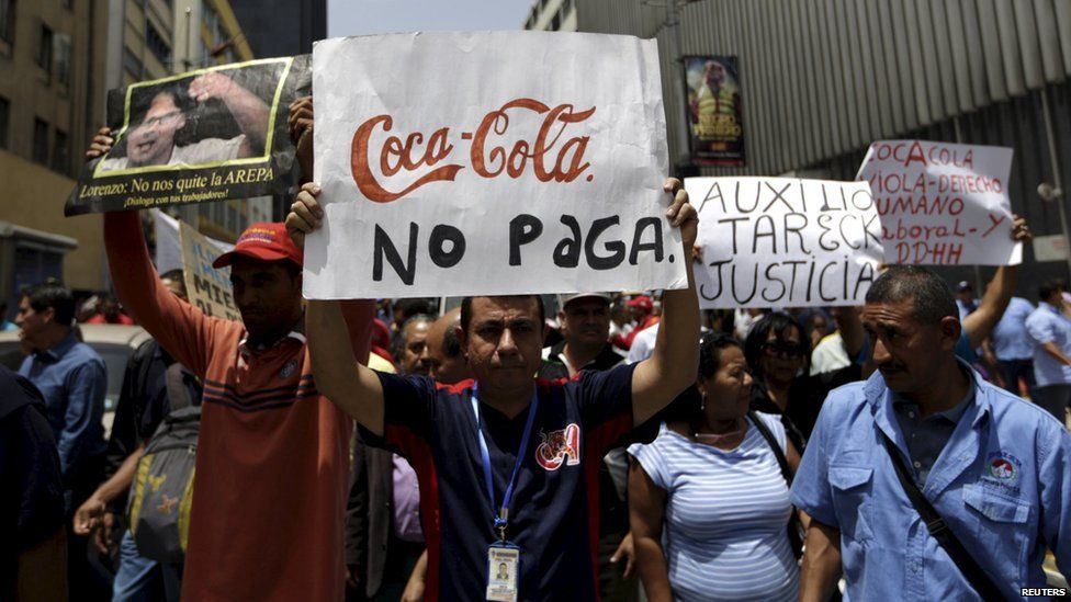 Union members of Polar's beer factory take part in a demonstration in Caracas 2 July 2015
