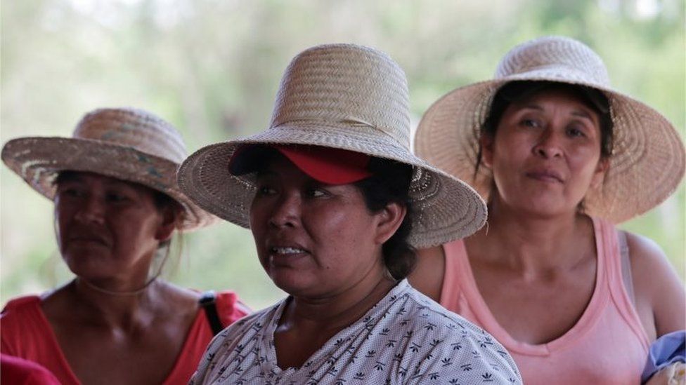 Women attend a meeting during their protest march near San José